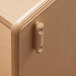 A close up of a wooden cabinet door with a KYDZ Suite Hub Connector Tab