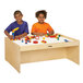 Two children playing with toys on a Jonti-Craft activity table.