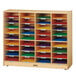 A Jonti-Craft wooden cabinet with colorful paper on shelves.