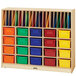 A Jonti-Craft wooden classroom organizer with colored cubbie trays on a wood shelf. The cubbie trays are blue, yellow, orange, and red.