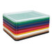 An almond Jonti-Craft Cubbie Tray Lid on a stack of plastic trays with different colors.