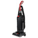 A black Sanitaire bagged upright vacuum cleaner with red accents and wheels.