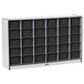 A white storage cabinet with black trim and black drawers.