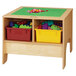 A wooden Jonti-Craft table with a green base and two colored bins on top.