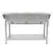 An Eagle Group stainless steel open well hot food table on a counter.