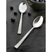 Two Amefa stainless steel dessert spoons with blueberries in a bowl.