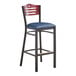 A Lancaster Table & Seating black bistro bar stool with navy vinyl seat.