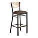 A black Lancaster Table & Seating bistro bar stool with a dark brown vinyl seat and natural wood back.