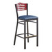 A Lancaster Table & Seating black bar stool with navy vinyl seat and mahogany wood back.