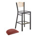 A Lancaster Table & Seating black bistro bar stool with a burgundy seat.