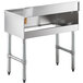 A Regency stainless steel underbar drainboard on a stainless steel table with legs.