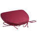 A red Lancaster Table & Seating Chiavari chair cushion with ties and a bow.