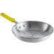 A Choice aluminum frying pan with a yellow silicone handle.