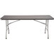 A National Public Seating charcoal slate rectangular table with metal legs.