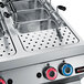 An Axis stainless steel dual tank gas pasta cooker on a counter in a professional kitchen.
