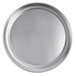 A close-up of a silver round Vollrath pizza pan.
