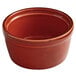 An Acopa Keystone Sedona Orange stoneware ramekin. A small brown stoneware bowl.