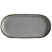 A gray rectangular stoneware platter with black speckles.