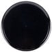 A black round catering tray with a high edge.