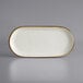 A white rectangular Acopa stoneware platter with brown speckled edges.