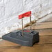 A Victor Quick-Kill Mouse Trap set on a wood floor.