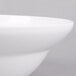 An American Metalcraft white melamine serving bowl with a white rim.