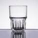 A Libbey short stackable beverage glass filled with water on a white background.