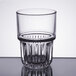 A close-up of a Libbey short stackable beverage glass with a textured surface.