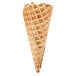 A close-up of a Keebler waffle cone with a bite taken out of it.