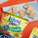 A close-up of a Wheat Thins Veggie Toasted Chip on a napkin.