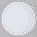 A Fineline white plastic plate with silver bands.