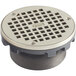 A Zurn polished nickel bronze drain cover with a metal grid over square openings.