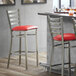 Lancaster Table & Seating Clear Coat Finish Ladder Back Bar Stool with 2 1/2" Red Vinyl Padded Seat Main Thumbnail 1