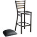 A Lancaster Table & Seating distressed copper finish metal ladder back bar stool with black vinyl padded seat.