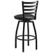 A Lancaster Table & Seating black finish ladder back swivel bar stool with a black cushion.