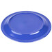 A blue Carlisle melamine plate with a white circle in the middle.