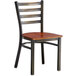 A Lancaster Table & Seating distressed copper finish ladder back chair with a wooden seat.