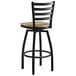 A Lancaster Table & Seating black bar stool with a wood seat.