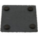 An Acopa black slate square coaster with four round black circles.