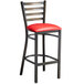 A Lancaster Table & Seating distressed copper ladder back bar stool with a red vinyl padded seat.