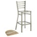 A Lancaster Table & Seating metal ladder back bar stool with a driftwood seat.