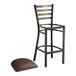 A Lancaster Table & Seating distressed copper finish metal ladder back bar stool with a dark brown cushion.