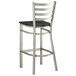 A Lancaster Table & Seating metal bar stool with black wood seat.