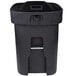 A black Toter rectangular plastic trash can with wheels and a locking lid.