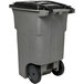 A gray Toter rectangular trash can with wheels and a black lid.