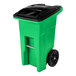 A lime green Toter rectangular rollout trash can with black wheels.