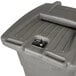 A Toter gray rectangular wheeled trash can with a lockable lid.