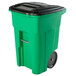 A lime green Toter rectangular rollout trash can with a black lid on wheels.