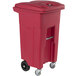 A red plastic Toter rectangular wheeled medical waste cart.