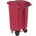 A red rectangular plastic Toter medical waste cart with wheels.